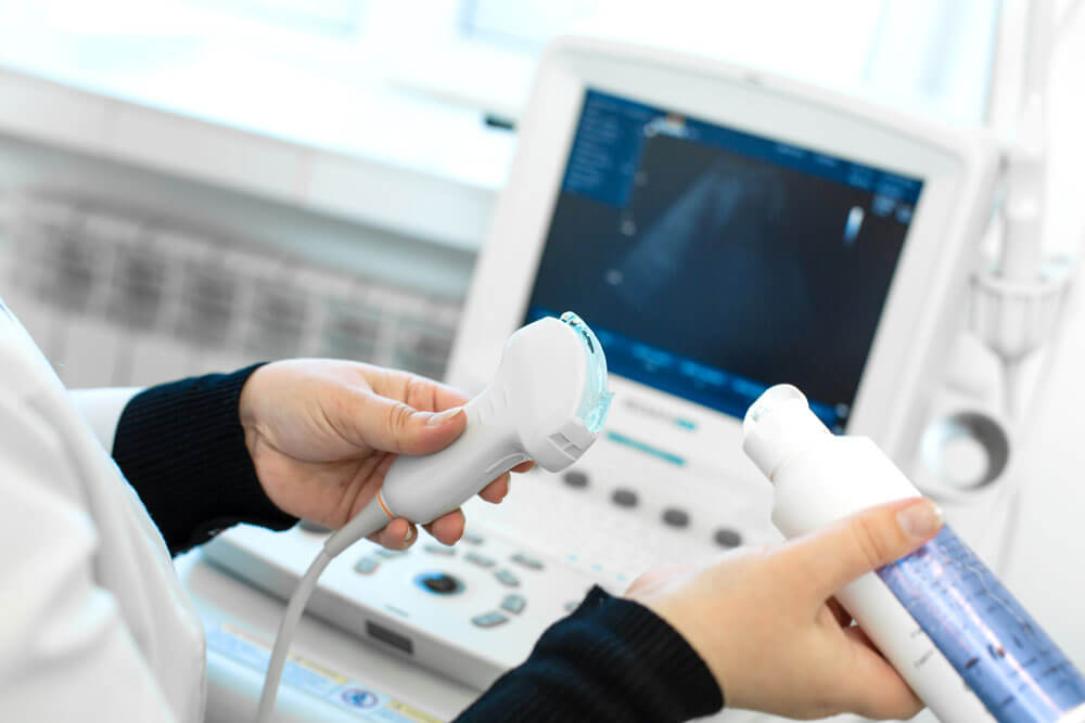 Gel is applied to a transducer prior to a venous Doppler test for blood clots.